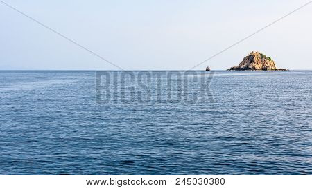 Beautiful Nature Landscape Of Shark Island Divesite On The Blue Sea, Small Rock Island At Ko Tao Dur