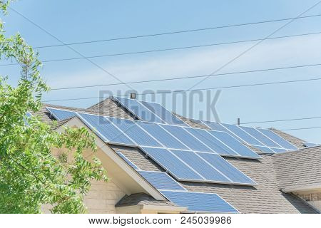 Solar Panel Installation On Asphalt Shingles Rooftop