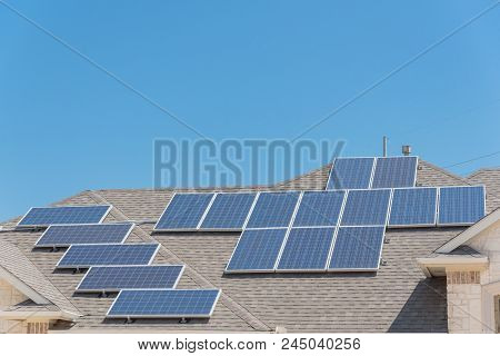 Solar Panel Installation On Asphalt Shingles Rooftop