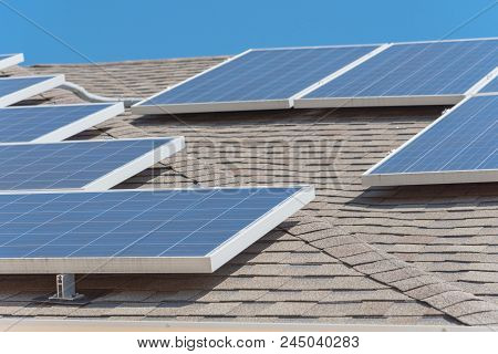 Solar Panel Installation On Asphalt Shingles Rooftop