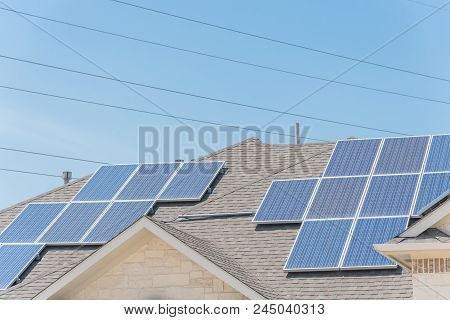 Solar Panel Installation On Asphalt Shingles Rooftop