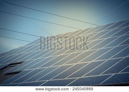 Solar Panel Installation On Asphalt Shingles Rooftop