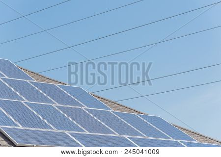 Solar Panel Installation On Asphalt Shingles Rooftop