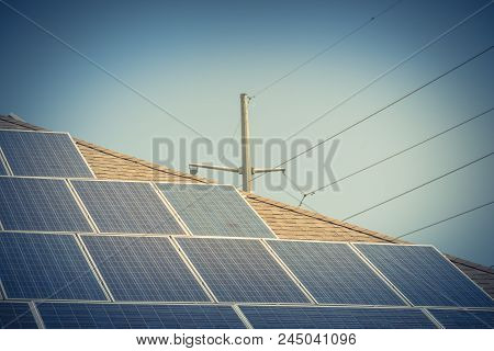 Solar Panel Installation On Asphalt Shingles Rooftop