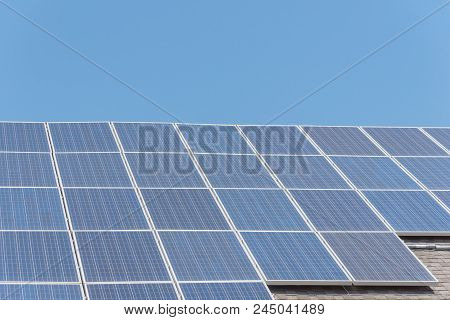 Solar Panel Installation On Asphalt Shingles Rooftop
