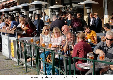 Malmo, Sweden - August 23, 2017: People At The Restaurants Outdoor Seatings Located At The Square Li