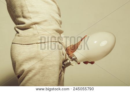 Man With Big Lamp Near Pants. Handjob And Masturbations. Power And Business Success. Energy And Elec