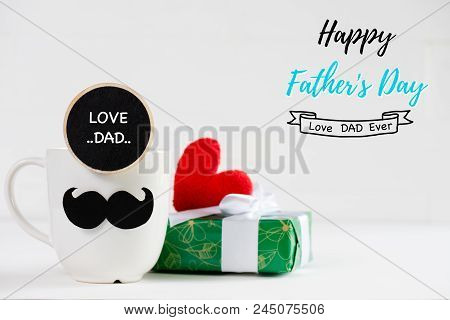 Happy Fathers Day Concept. Handmane Red Heart On Beautiful Gift Box With Mustache And Wooden Tag Wit