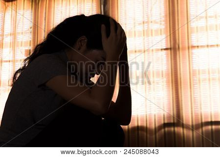 Depression Asian Woman Is Sad And Stress In Bedroom, Close Up At Face