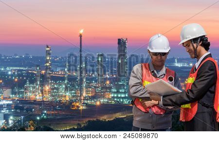 Two Engineer On Site With Oil Refinery