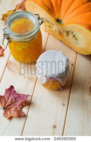 Autumn Still Life Of Homemade Pumpkin Jam On Natural Wood Table, Stock Photo Image