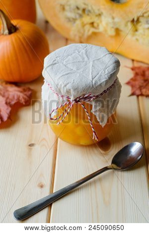 Autumn Still Life Of Homemade Pumpkin Jam On Natural Wood Table, Stock Photo Image