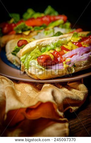Fancy Grilled Hotdogs With Many Toppings Including Relish And Sauerkraut