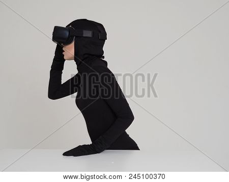 Woman Is Posing In Vr Headset. An Excited Woman Experiencing The Virtual Reality Helmet. Hi-tech Gad