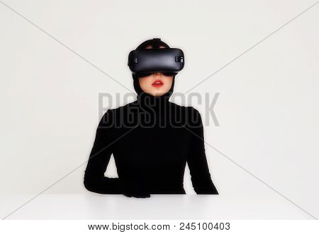 An Excited Woman Experiencing The Virtual Reality Helmet. Hi-tech Gadgets For Geeks And Technical En