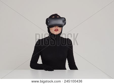 An Excited Woman Experiencing The Virtual Reality Helmet. Hi-tech Gadgets For Geeks And Technical En