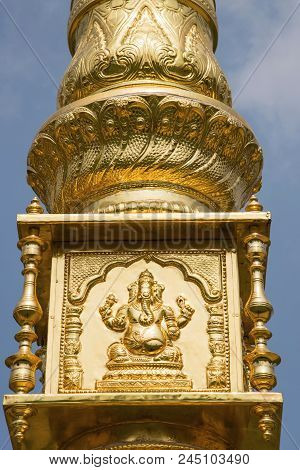 Carved Ganapati On Dhvaja Sthambha Outside The Temple. This Is A Flagstaff That Usually Features In