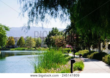 Beautiful House At Lake In Sunny Day, California