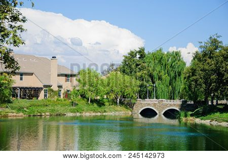 Beautiful House At Lake In Sunny Day, California