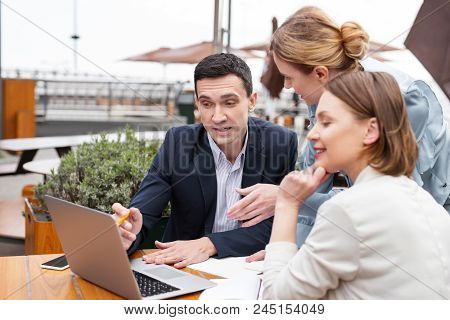White Collar. Experienced White Collar Worker Feeling Curious While Explaining Actively Future Work 