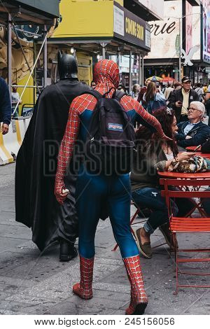 New York, Usa - May 28, 2018: People Dressed In Batman And Spiderman Costumes Walk Through Times Squ