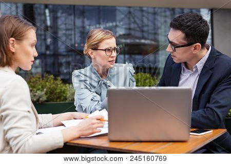 Dispute With Co-worker. Beautiful Prosperous Businesswoman In Glasses Feeling Involved In Having Dis