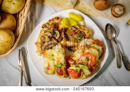 Italian Chicken Marsala With French Vegetable Tian And Stuffed Sausage