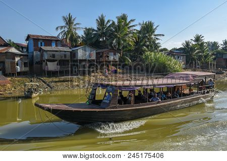 Boat Navigating A Tributary River To The Tonle Sap Lake