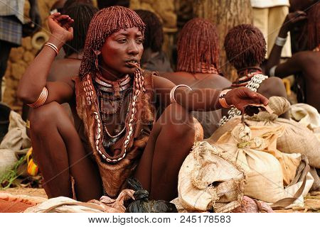 Turmi, Omo Valley, Ethiopia - 29 July 2013: Portrait Of The Woman With The Small Child On The Hand F