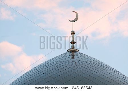 The Symbol Of Islam Is A Golden Crescent Moon On Top Of The Mosque Minaret On The Blue Evening Of Th