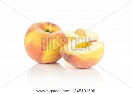 One Ripe Yellow Peach And Two Halves Isolated On White Background