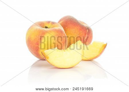 Ripe Yellow Peaches With Two Slices Isolated On White Background