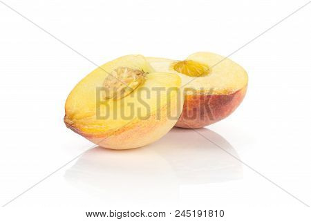 One Yellow Peach Cut In Two Halves Isolated On White Background