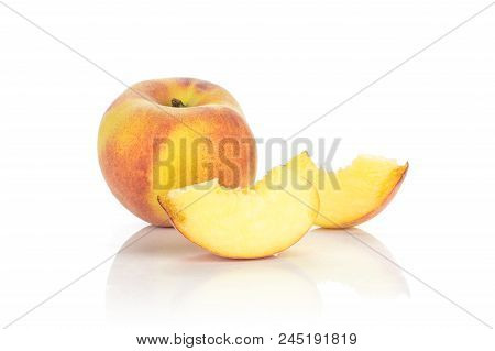 One Yellow Peach And Two Sliced Pieces Isolated On White Background