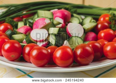 Vegetables For A Picnic, Tomatoes, Cucumbers, Radish, Green Onion In Closeup View