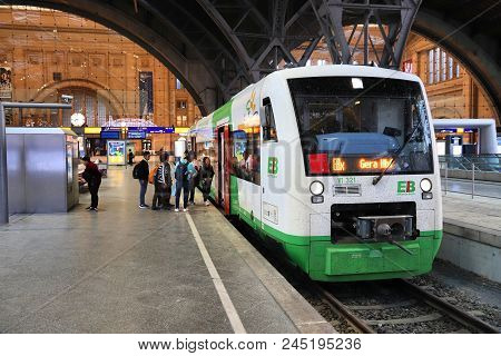 Leipzig, Germany - May 9, 2018: People Board Erfurter Bahn Train At The Railway Station (hauptbahnho