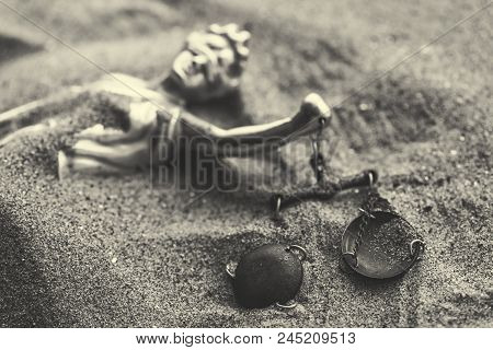 Statue Of Lady Justice With Scale Buried In Sand, Concept Of Unsolved Cold Case Crime