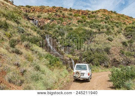 Lady Grey, South Africa - March 29, 2018: A Vehicle At A Waterfall In The Historic Jouberts Pass At 