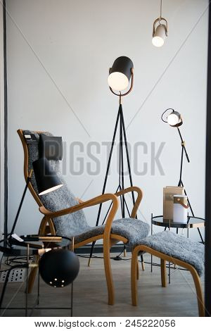 Apartment With Modern Armchairs And Blue Wall.