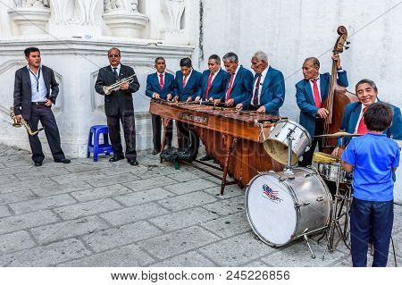 Cuidad Vieja, Guatemala - December 7, 2017: Local Marimba Band Plays Outside Church Celebrating Our 