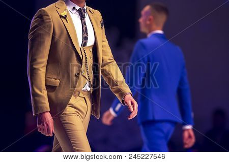 Sofia, Bulgaria - 28 March 2018: Male Model Walks The Runway In Beige Suit During A Fashion Show. Fa