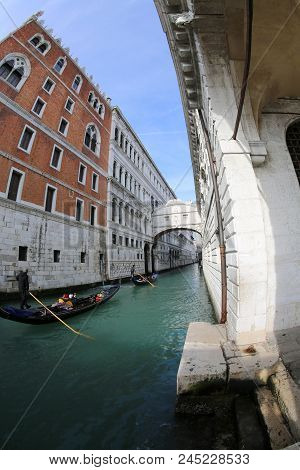 Ancient Bridge Of Sighs And Old Ducal Palace Photographed By Fish Eye Lens And A Gondola Boat Wtih G