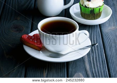 A сup Of Fragrant Tea With Delicious Cake In White Dish