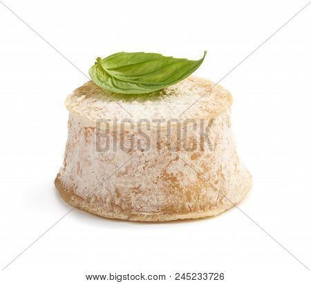 Crottin Cheese With Basil Leave Isolated On White Background