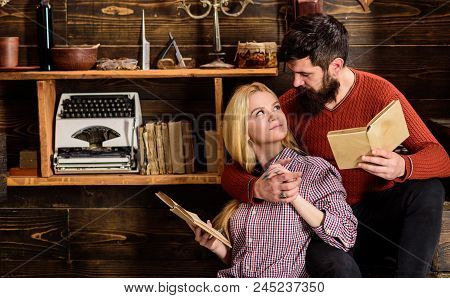 Friends Reading Book And Studying At Loft Vintage Apartments. Woman And Attractive Man Wearing Casua