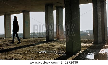 Young Woman With Modern Haircut Walking In The Bouilding. Professional