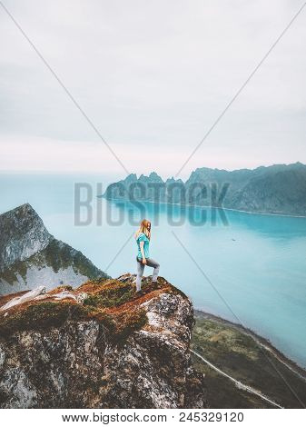 Summer Vacations Travel Journey Woman Traveler On Mountain Cliff Over Sea Alone Hike In Norway Adven