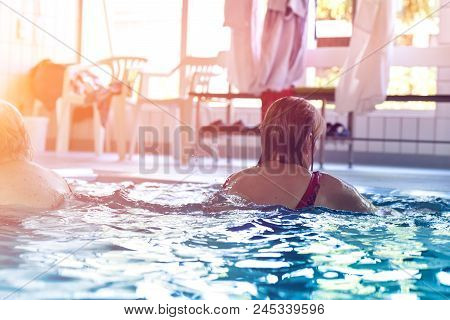 Group Or Young And Senior People In Aquarobic Fitness Swimming Pool Exercising Water Sport