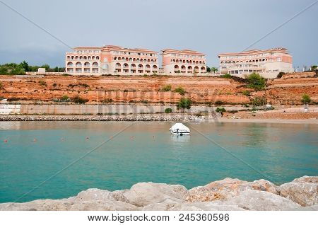 Residential Buildings On Red Sedimentary Rocks