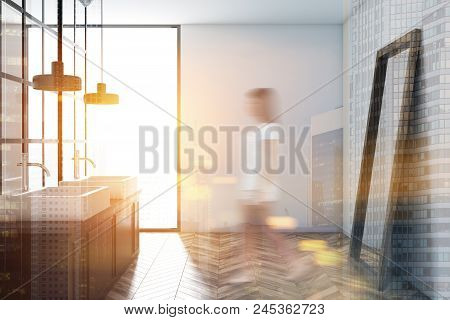 White Wall Bathroom Interior With A Metal Decoration Details, A Wooden Floor And A Double Sink With 